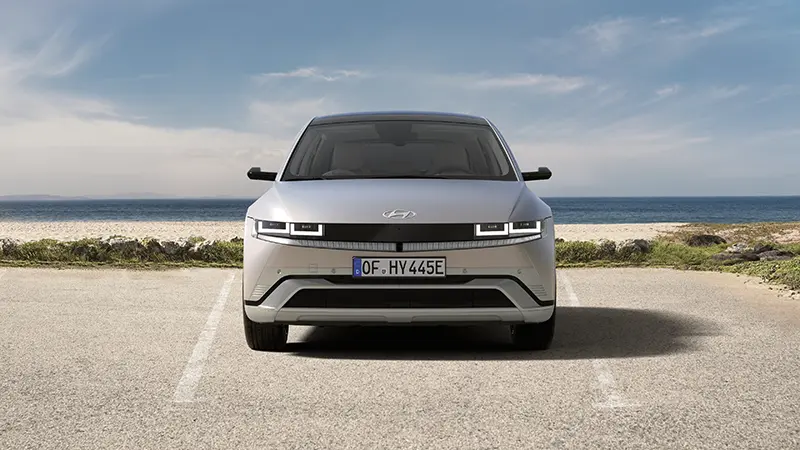 Direct front view of Hyundai IONIQ 5 highlighting parametric pixel LED light bar and grille-less front fascia