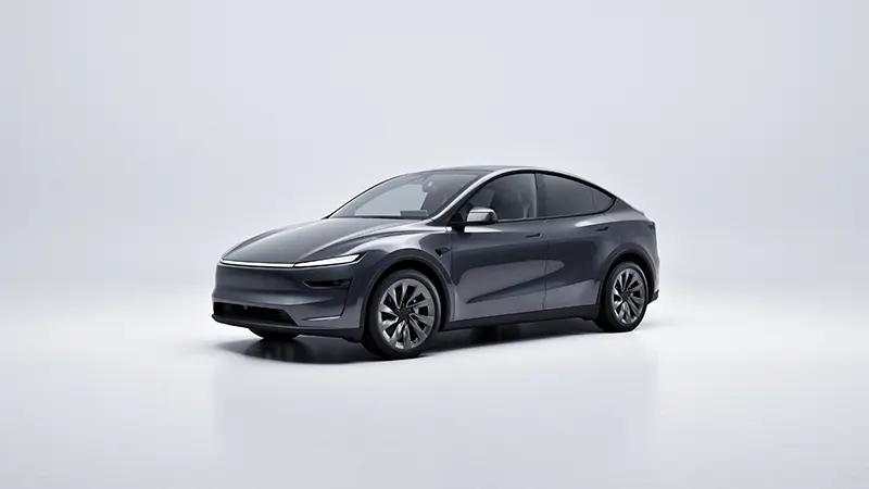Tesla Model Y electric SUV exterior 3/4 front angle showing sleek aerodynamic profile and minimalist design