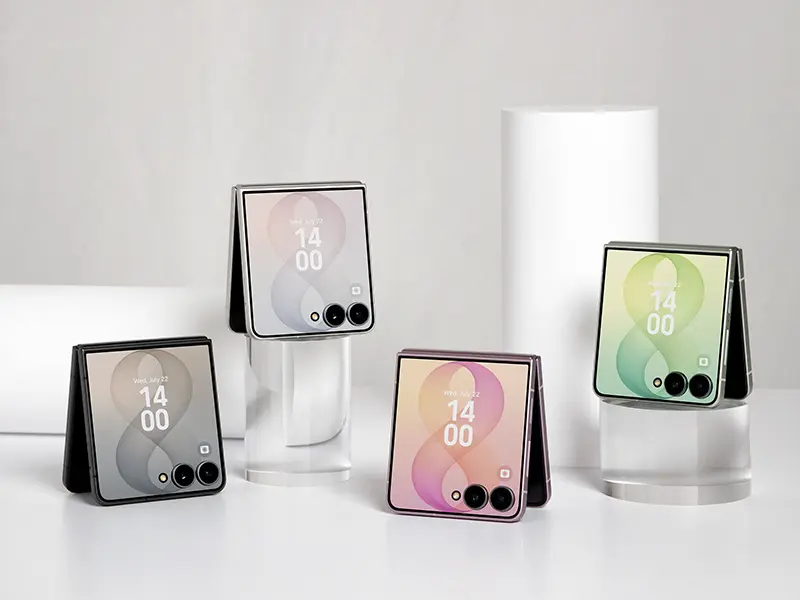 Four Galaxy Z Flip8 colors — graphite, cream, pink and mint — standing half-folded on risers with their cover screens lit