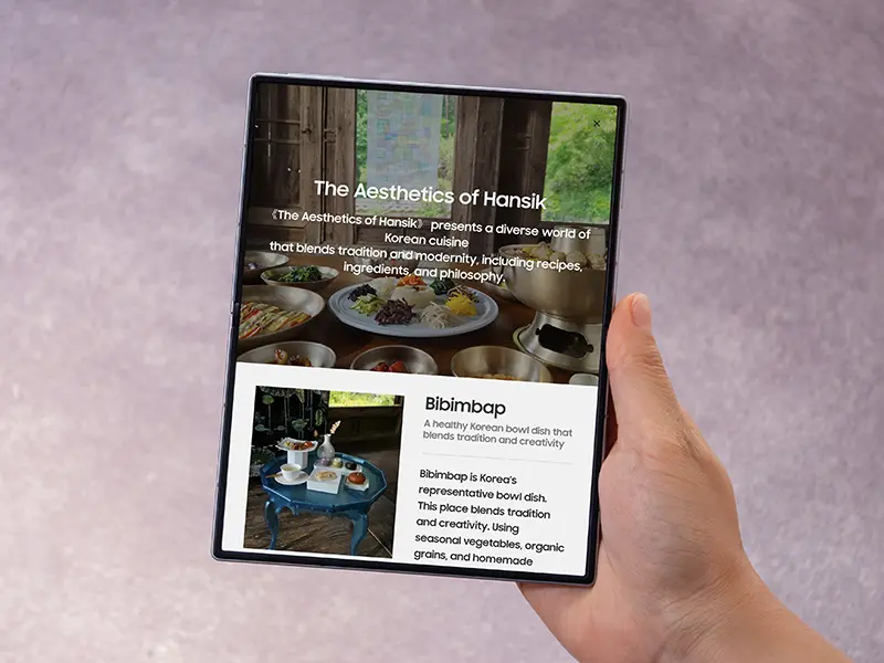 Unfolded Galaxy Fold8 Wide held upright as a reader scrolls an article across the 4:3 portrait screen