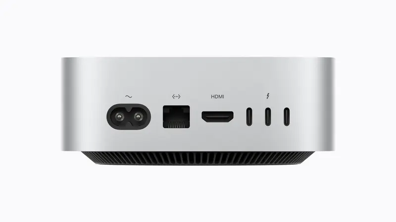 Straight-on rear view showing the power inlet, Ethernet, HDMI and three Thunderbolt ports, the Mac mini M6 vs M4 baseline